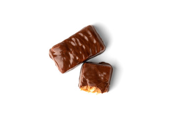 Chocolate sweet with caramel and peanut isolated on white background.