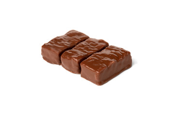 Chocolate sweet with caramel and peanut isolated on white background.