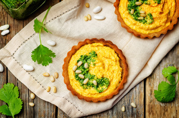 buckwheat tartlets with with white beans carrot hummus and cilantro pesto