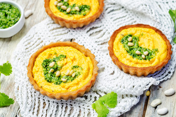 buckwheat tartlets with with white beans carrot hummus and cilantro pesto
