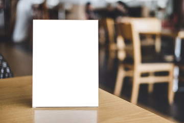 Mock up acrylic frame posters pattern template forms background, blank menu frame on table in coffee shop stand for your text of display your product