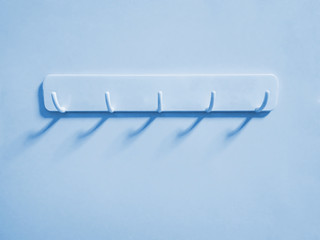 Cyan Plastic Hooks for Cloth Hanging on Cyan Wall