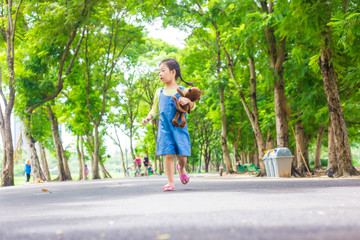 Fototapeta na wymiar Portrait of asian adorable girl recreation in city park