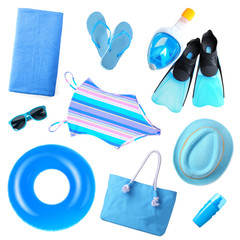 Set of different blue beach accessories on white background, top view