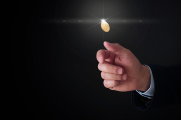 Businessman throwing coin on black background, closeup. Space for text