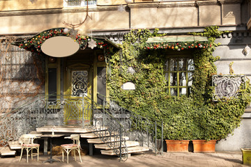 Beautiful view of building with green vine on sunny day