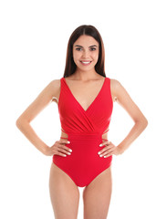 Portrait of attractive young woman with slim body in swimwear on white background