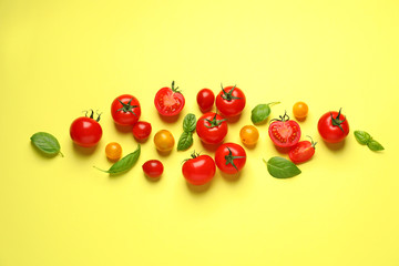 Flat lay composition with cherry tomatoes on color background