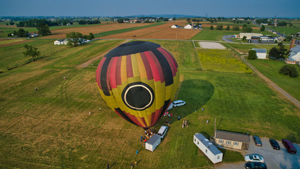 Obraz premium Aerial View of Hot Air Balloons Trying to Launch in a Wind as Seen by a Drone