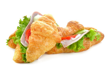 Fresh croissant sandwich isolated on white background.