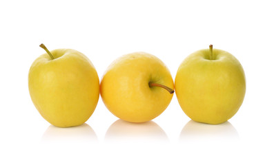 Ripe yellow apple isolated on white