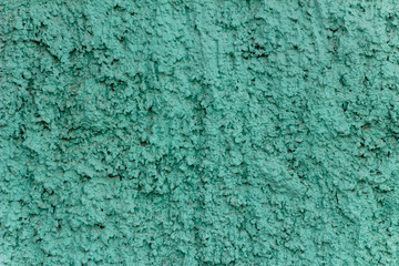 Fototapeta na wymiar green blue turquoise concrete wall with deep relief and shadows. rough texture surface