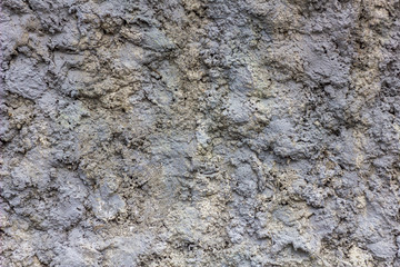 gray concrete wall with deep relief. rough surface texture