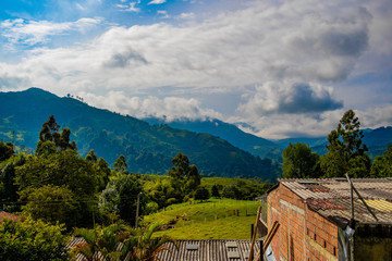 view over a beautiful south american mountain landscape with blue sky in colombia,  salento