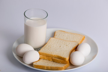 closeup bread slice milk glass in plate