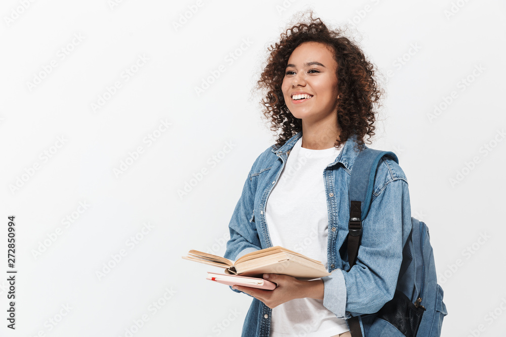 Wall mural Portrait of a pretty cheerful casual african girl