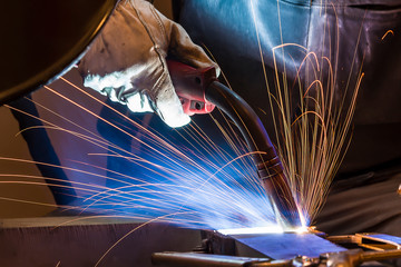 Industrial steel welder in factory welder, craftsman