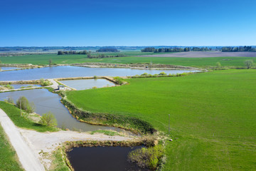Fototapeta na wymiar Fish ponds in rural landscape.