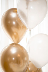 GOLD AND WHITE BALOONS