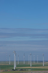 Fototapeta na wymiar Windmills in Dutch Polder Netherlands. Green energy.