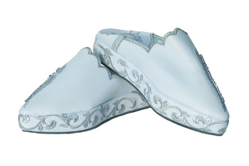 Slippers woman isolated. Closeup of elegant luxurious handmade light blue ladies slippers with...