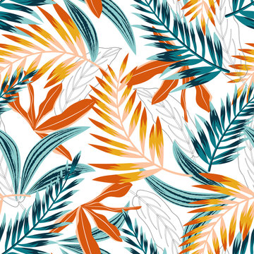 Fototapeta Trend seamless pattern with bright tropical leaves and plants on white background. Vector design. Jung print. Floral background. Printing and textiles.