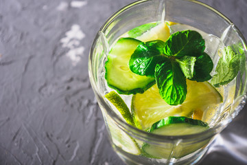 Close-up of detox drink of cucumber, lemon and mint with copy space