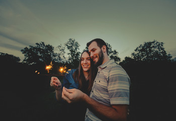 Loving Couple doing Sparkler Fireworks Together