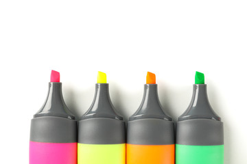 Color office highlighters isolated on white background, top view