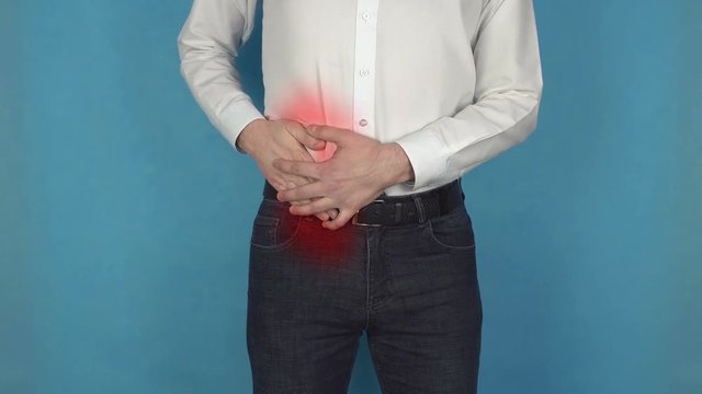 Kidney stone disease. Man has pain due to Appendicitis. Concept of Cirrhosis. Person infected with Hepatitis or Worm infection. Manager in white shirt suffers from Cholecystitis or Urolithiasis.