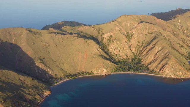 Late afternoon light illuminates the scenic island of Gili Banta, just outside of Komodo National Park, Indonesia. This tropical area is known for its marine biodiversity.