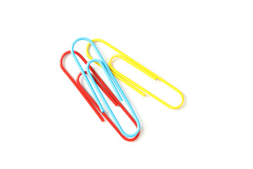 Color paper clips isolated on white background, closeup
