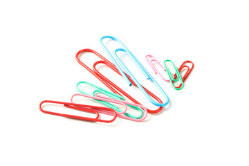 Color paper clips isolated on white background, closeup