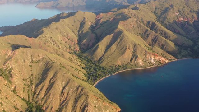 Late afternoon light illuminates the scenic island of Gili Banta, just outside of Komodo National Park, Indonesia. This tropical area is known for its marine biodiversity.