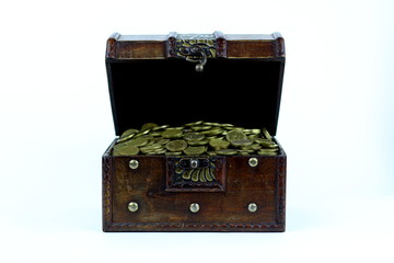 An old wooden chest full of gold coins. An old treasure, a treasure.