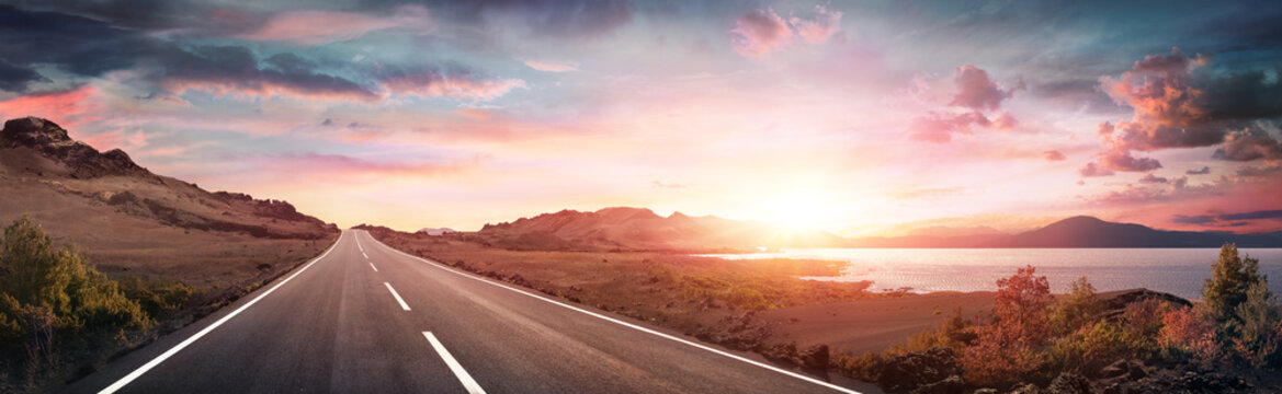 Road Trip - Scenic Landscape With Highway At Sunrise