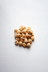 Fototapeta na wymiar Heap of hazelnuts isolated on white background