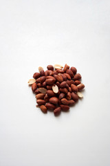 Heap of peanuts isolated on white background