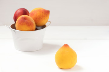 Yellow peach isolated on the white background.