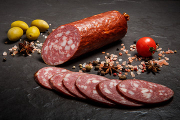 delicious dry smoked salami sausage with green olives and tomato