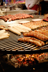 Large round barbecue of sausages and grilled meat