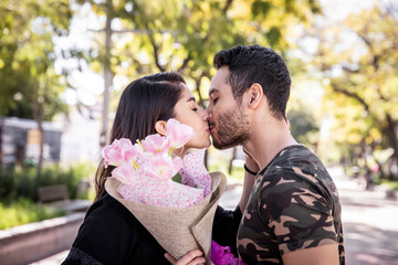 Couple in love. Enjoying happy in public park