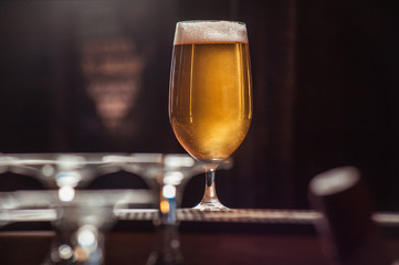 Beer glass on the bar counter