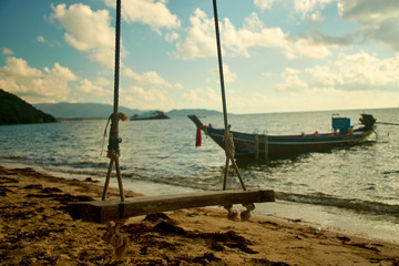 Fototapeta premium Sunrise about sea with boat in Thailand