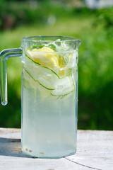 refreshing detox drink of cucumber and lemon in a glass