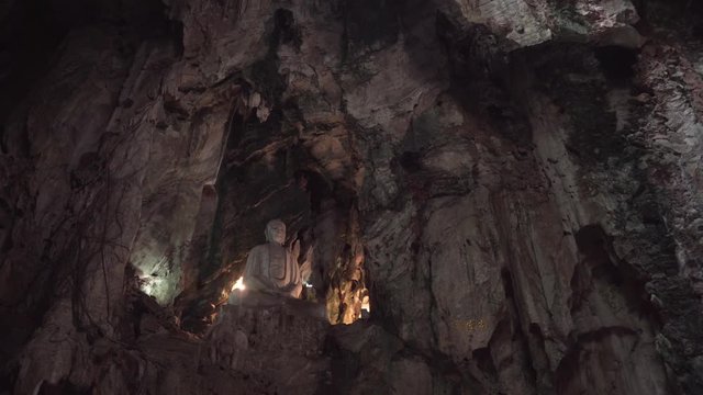 Buddha Statue inside a cave at Marble Mountains in Da Nang, Vietnam