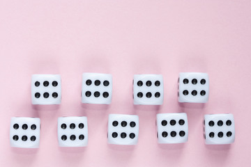 Gaming dices on pink background.