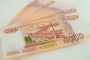 Obraz premium 5000 rubles lie on a white table close up.