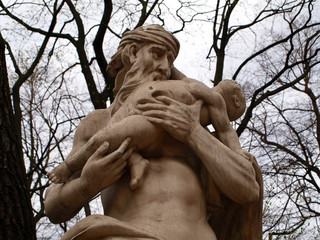 Marble statue of saturn roman god  in summer garden Saint Petersburg, Russia
