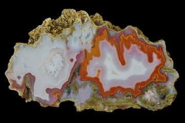 A cross-section of agate. Agate with quartz and chalcedony in the middle part. Multicolored silica...